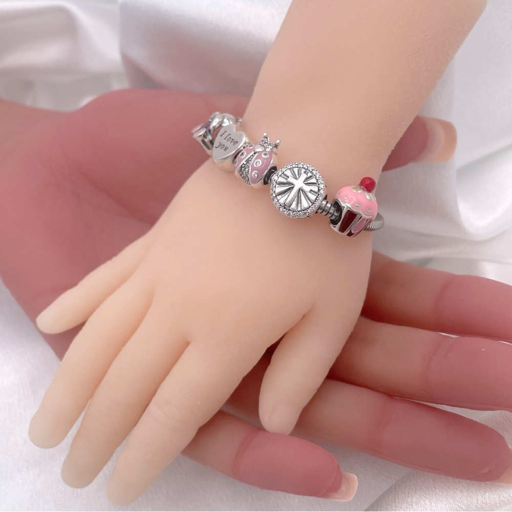 Linx Child’s snake chain charm bracelet with a heart extender and 5 Linx Charms